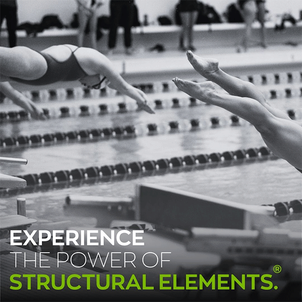 swimmers jumping off block